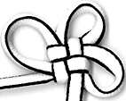square flower knot tied in white and black shoelace