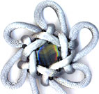 back of grey hexagonal stellar knot with little beads