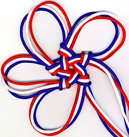 pentagonal stellar knot in red, white, and blue with twisted ears